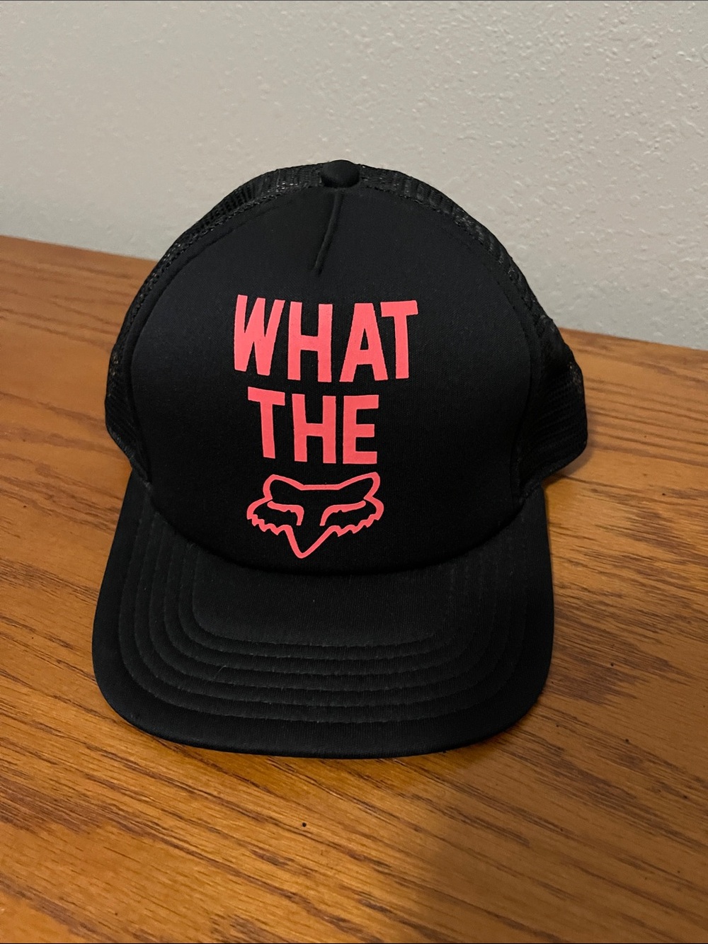 Fox Black Trucker Hat with Pink "WHAT THE" Graphic